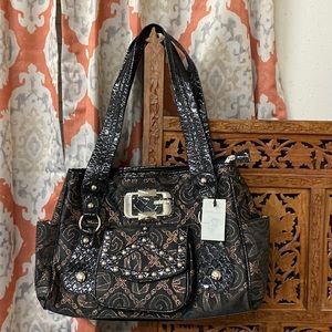 Western style purse brown with gold designs going all through it. Leopard print